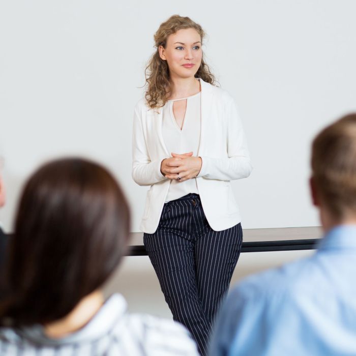 Young Female Businesswoman Holding Report